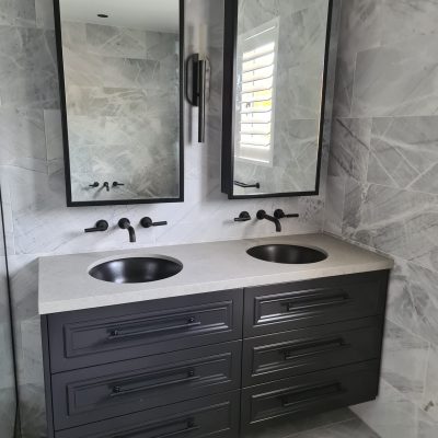 black-vanity-with-metal-framed-mirrors